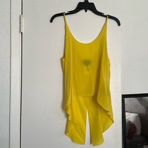 Beautiful yellow silk blouse. Hi low style with split back.